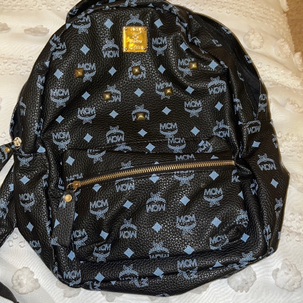 MCM Designer Back , Bought Last Year . Broken Zipper . Like New otherwise